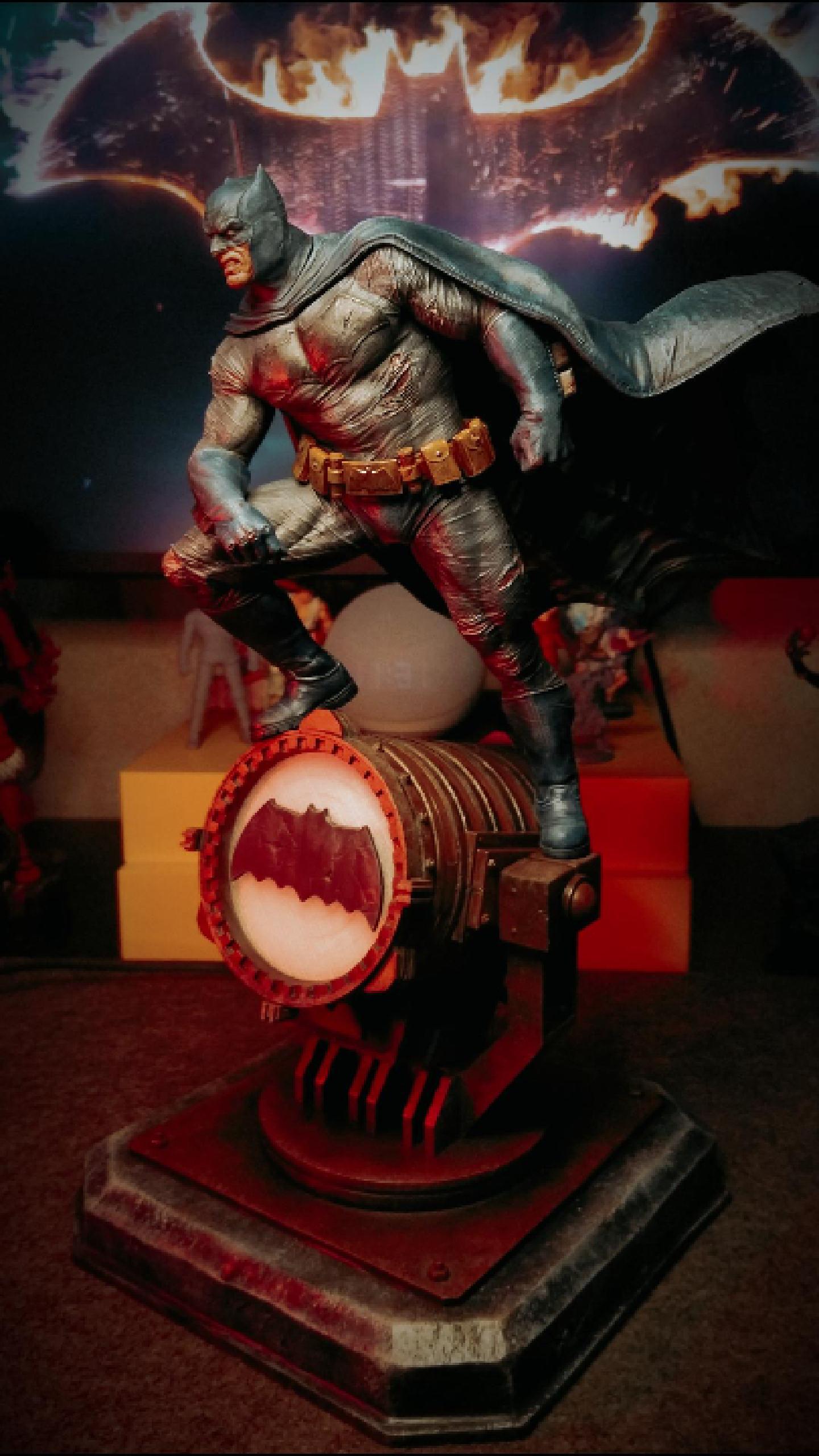 Custom resin 3D printed and hand-painted Batman statue on an illuminated display base.